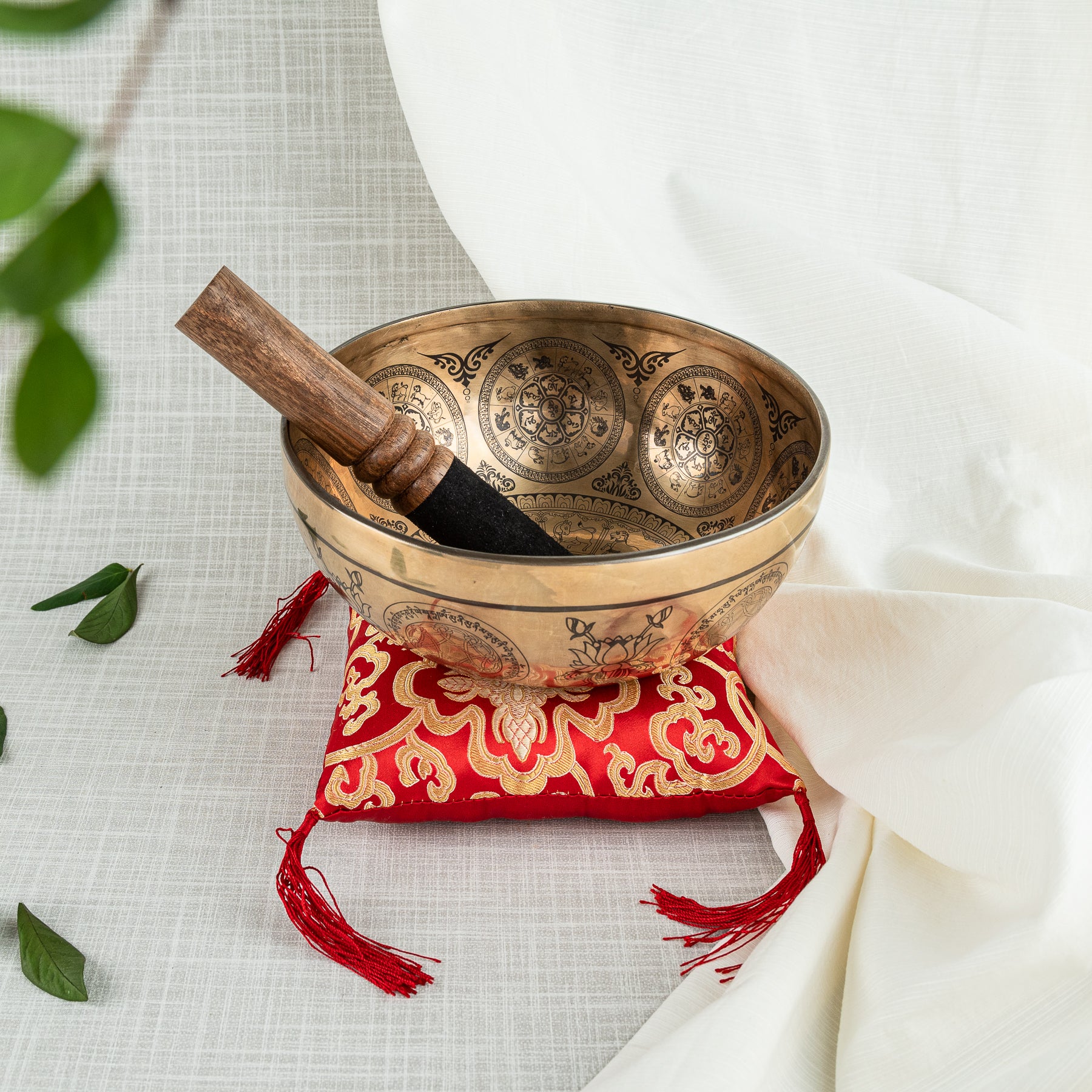 Red cushion with singing bowl