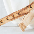 Palo santo sticks with crescent moons on them