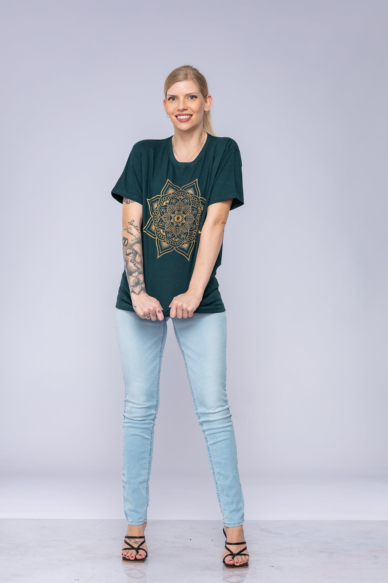 Green mandala t-shirt worn by woman