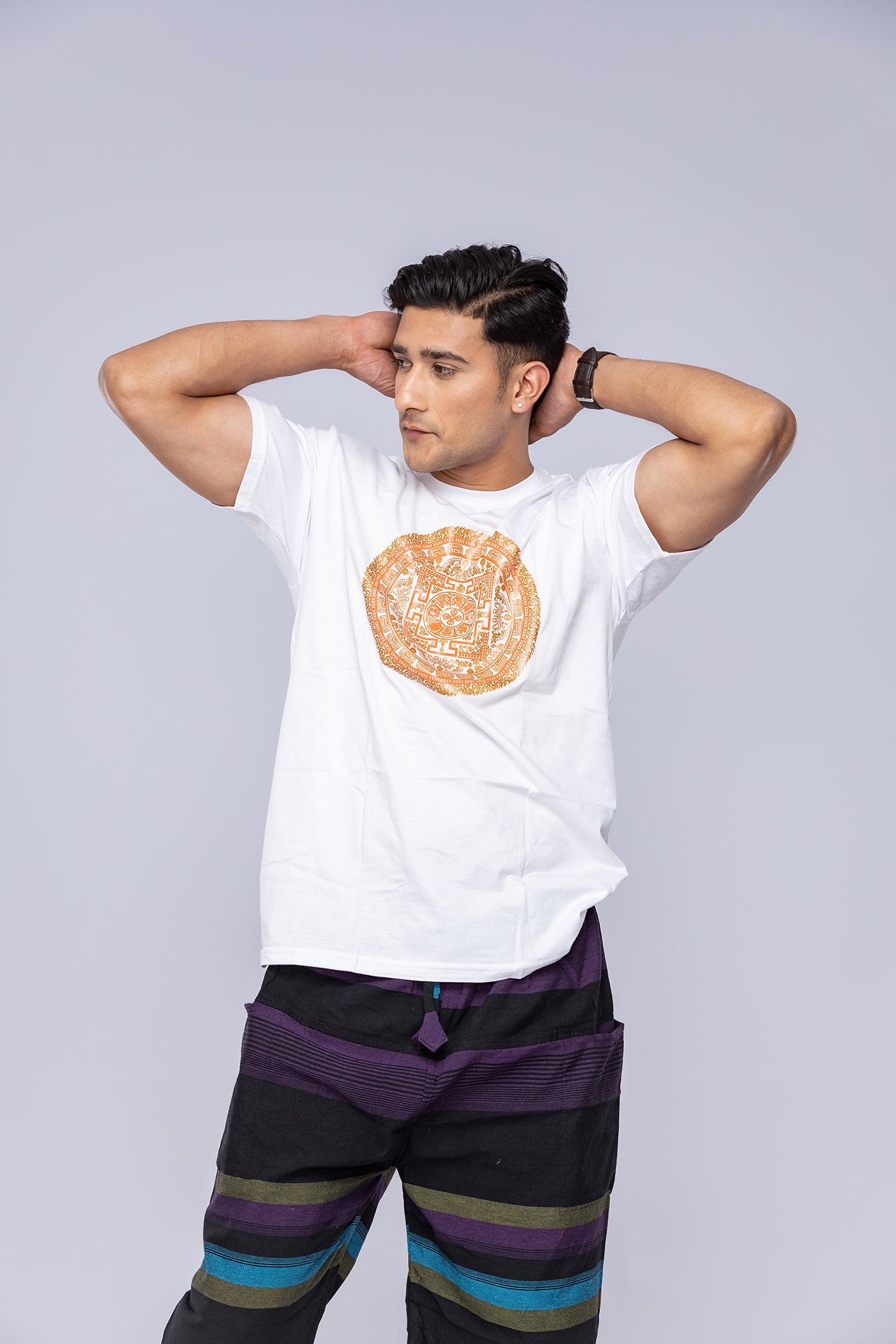 Man wearing white Vajra mandala t-shirt