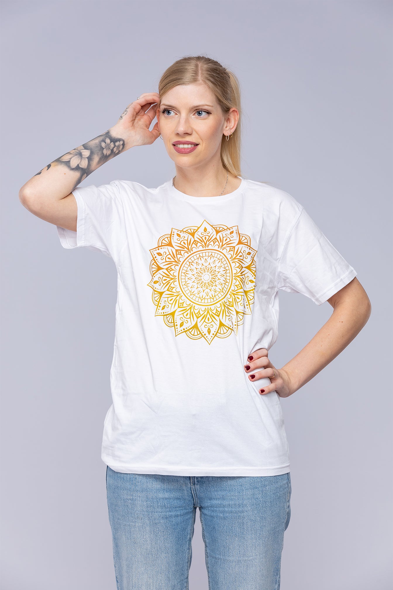 Woman wearing a white mandala t-shirt