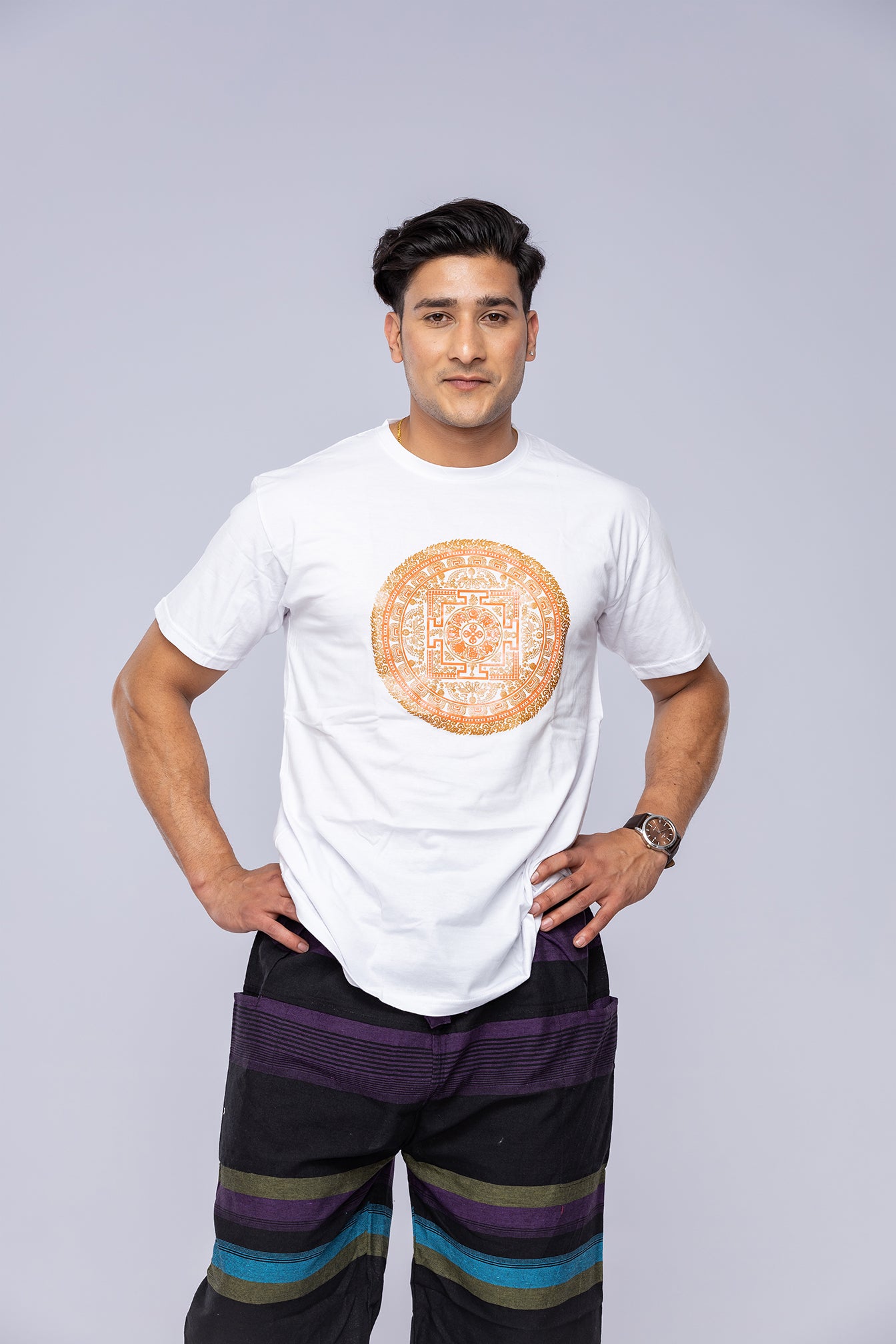 Man wearing white Vajra mandala t-shirt